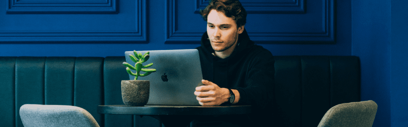 Image of man working on a laptop